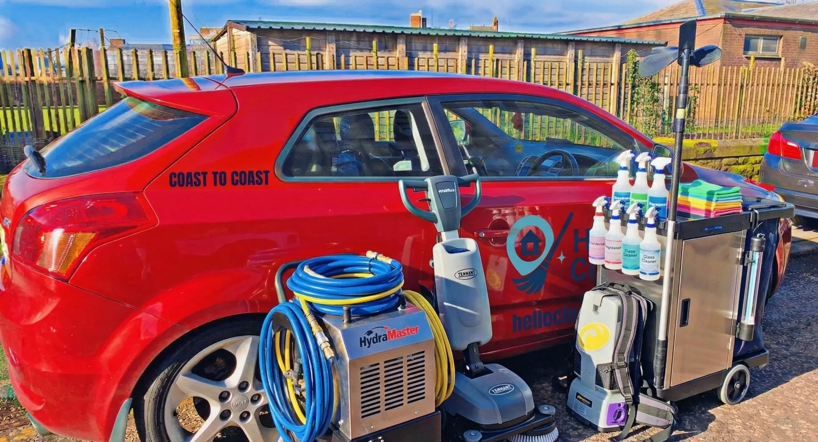 Professional Hello Cleaners equipment: floor scrubber, extraction machine, supply cart and labelled cleaning products